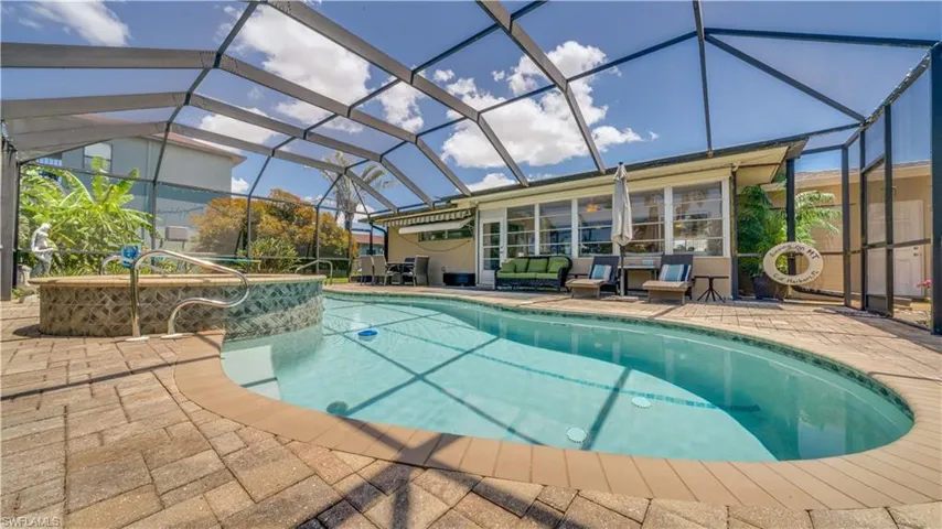 Beautiful paver decking and high screened cage.