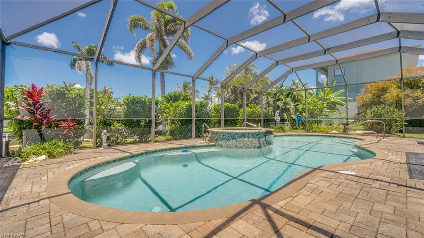 Surrounded by lush tropical landscaping.