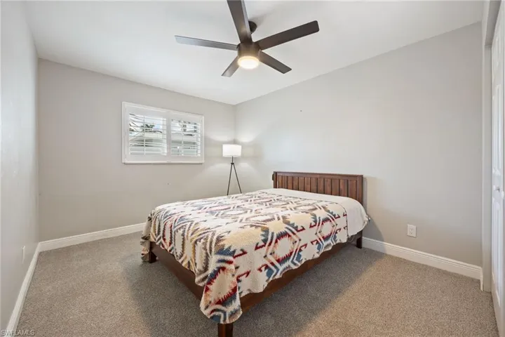 Bedroom featuring carpet and a ceiling fan