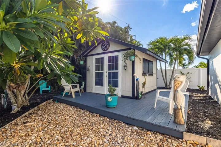 View of outbuilding featuring a fenced backyard