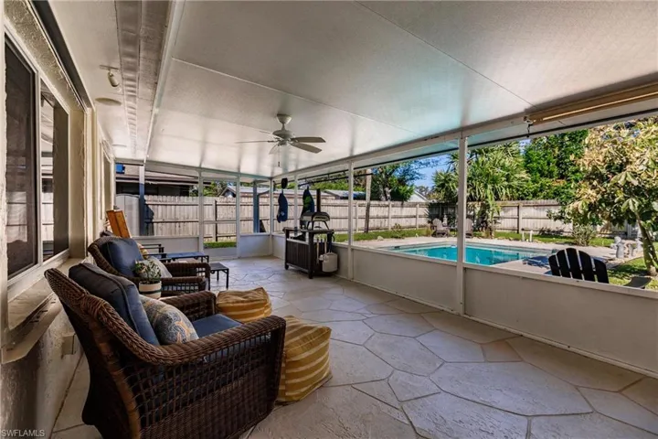 Sunroom featuring ceiling fan