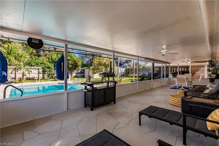 Sunroom with ceiling fan and plenty of natural light
