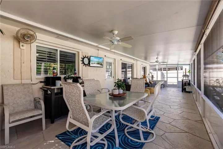 Sunroom / solarium featuring a wealth of natural light and ceiling fan