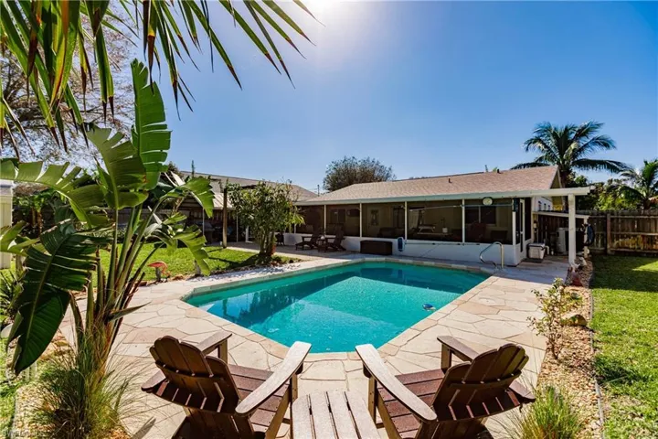 View of pool featuring a patio and a sunroom
