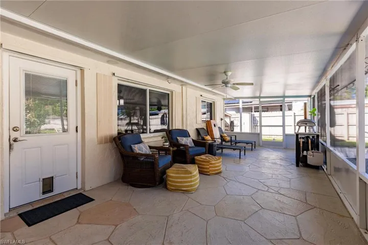 Sunroom with ceiling fan and a healthy amount of sunlight