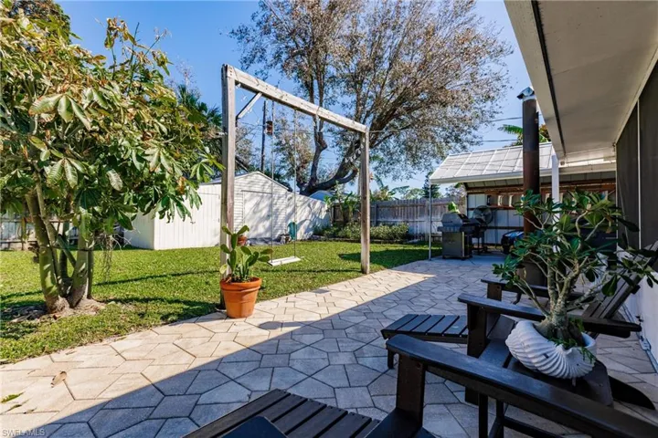View of patio / terrace with a shed