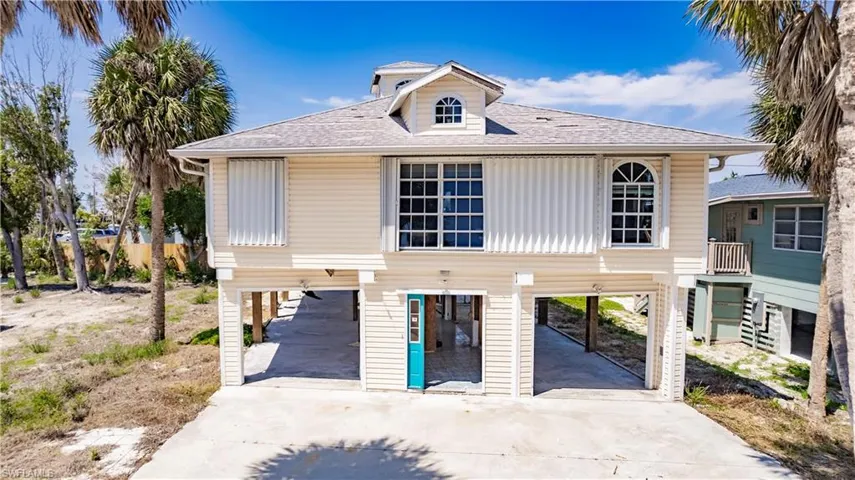 View of front of property with a carport