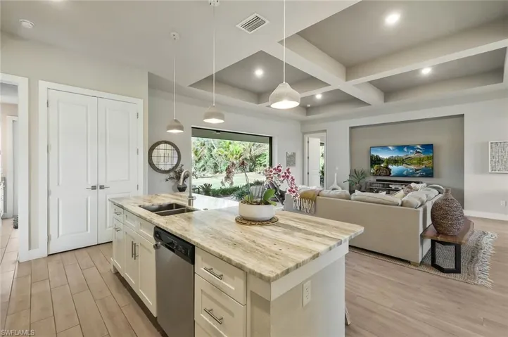 Fantasy Brown quartzite and Moen Align fixtures throughout