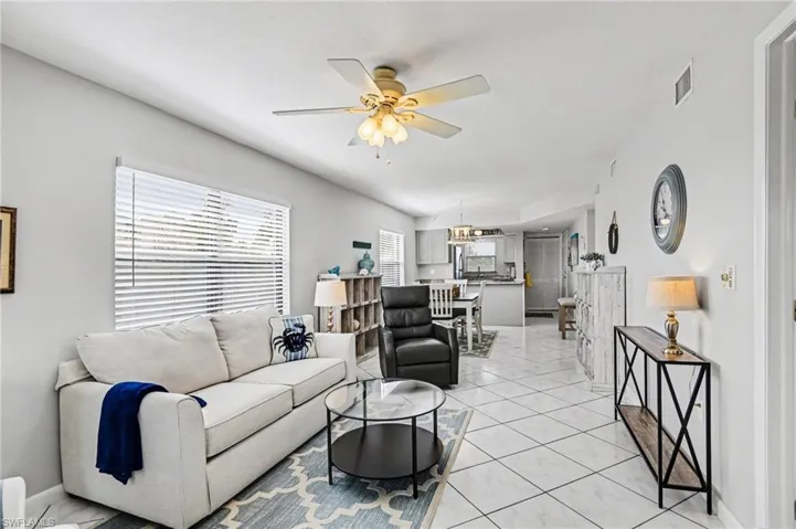 MAIN LIVING AREA.  QUEEN SLEEPER SOFA.  ENTRANCE TO OWNER'S SUITE IS TO RIGHT.  ENTRANCE TO UNIT IS SHOWN AT REAR.
