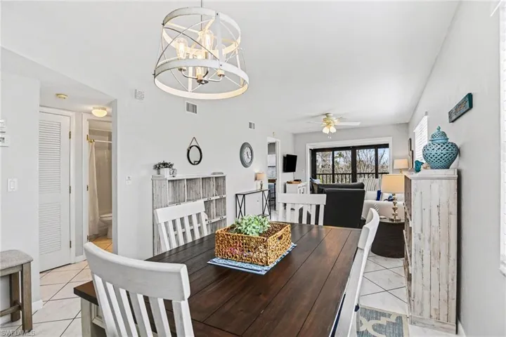VIEW FROM DINING AREA.  ENTRANCE TO GUEST BEDROOM, GUEST BATH AND LAUNDRY IS SHOWN AT LEFT.