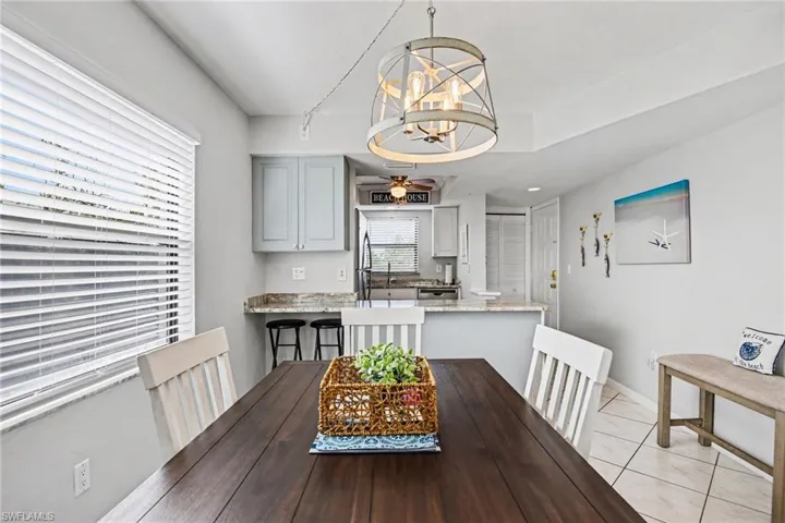 VIEW FROM DINING AREA TOWARDS KITCHEN AND UNIT ENTRANCE