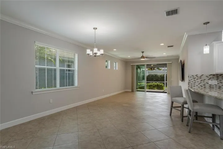 Great room view with kitchen and lanai.