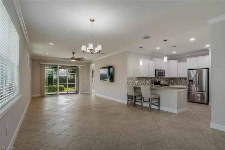 Open, flexible floor plan with spacious great room adjacent to modern kitchen, opening to private lanai.