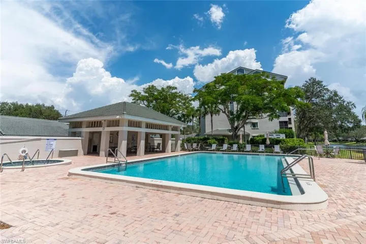 Community pool with a patio area