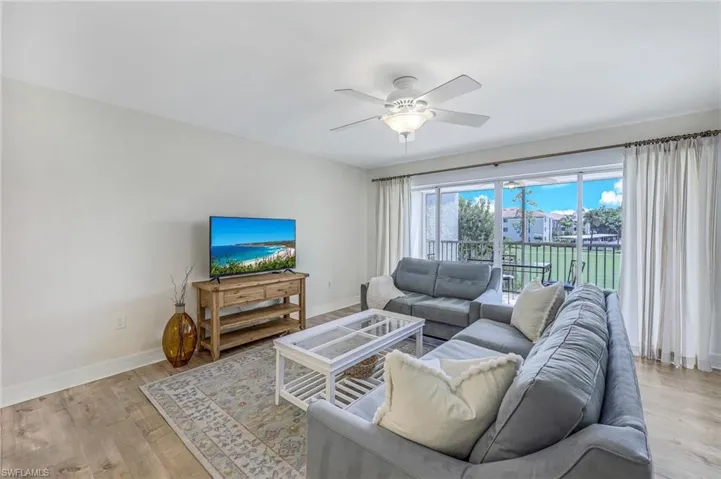 Large living area with golf course views.