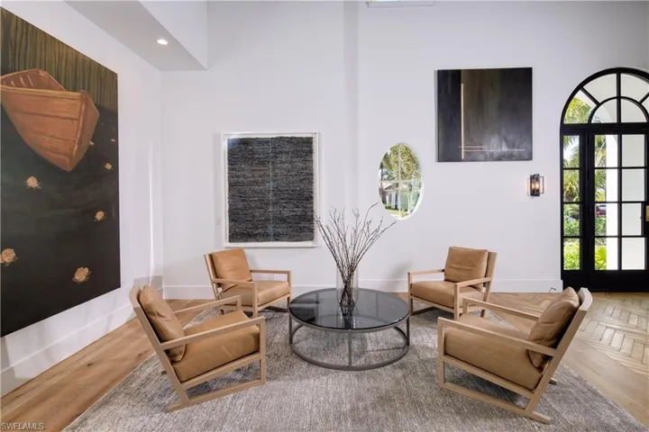 Living area featuring parquet flooring and recessed lighting