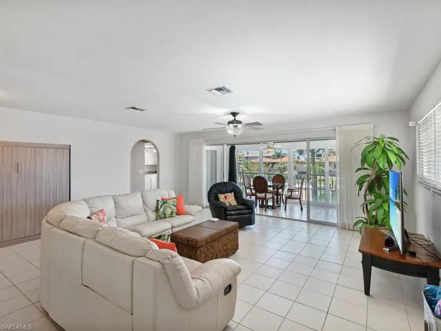 Tiled living room with ceiling fan