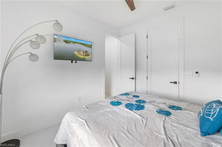 Bright interior space featuring white walls and white baseboards