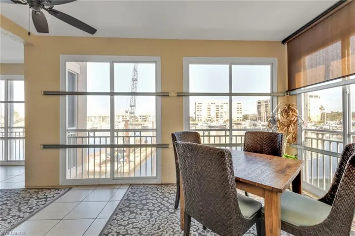 Tiled dining area featuring ceiling fan