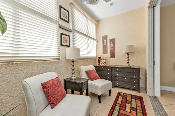 Living area with light tile patterned floors