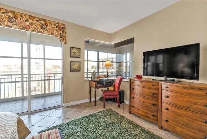 Home office with light tile patterned flooring