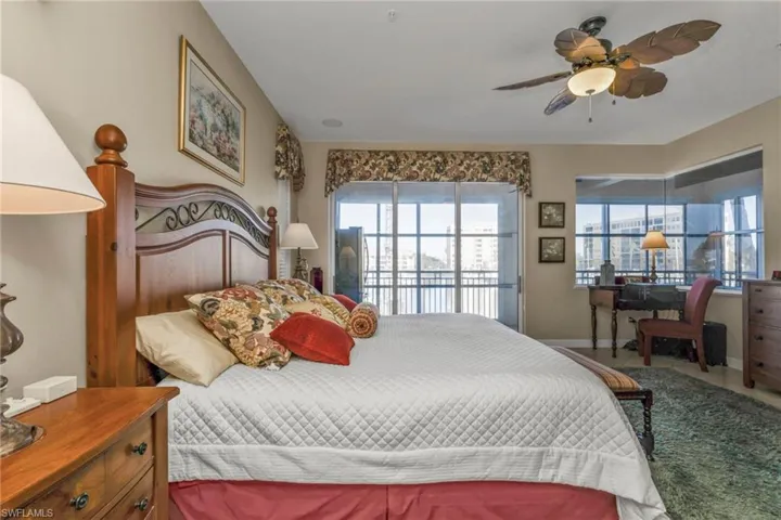 Bedroom with access to exterior and ceiling fan