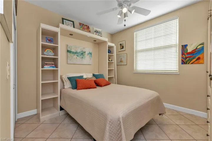 Bedroom featuring ceiling fan and light tile patterned flooring