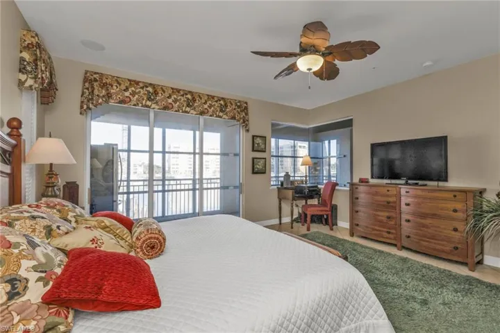 Bedroom featuring access to exterior and ceiling fan