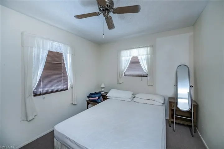 Bedroom featuring carpet flooring and a ceiling fan