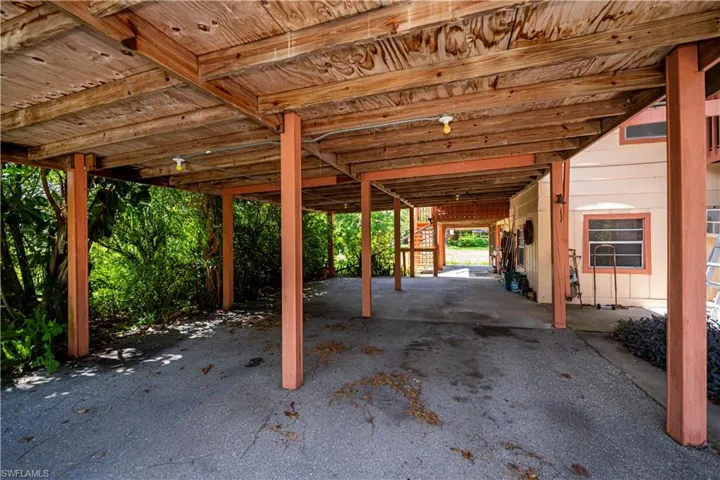 View of patio / terrace featuring a carport