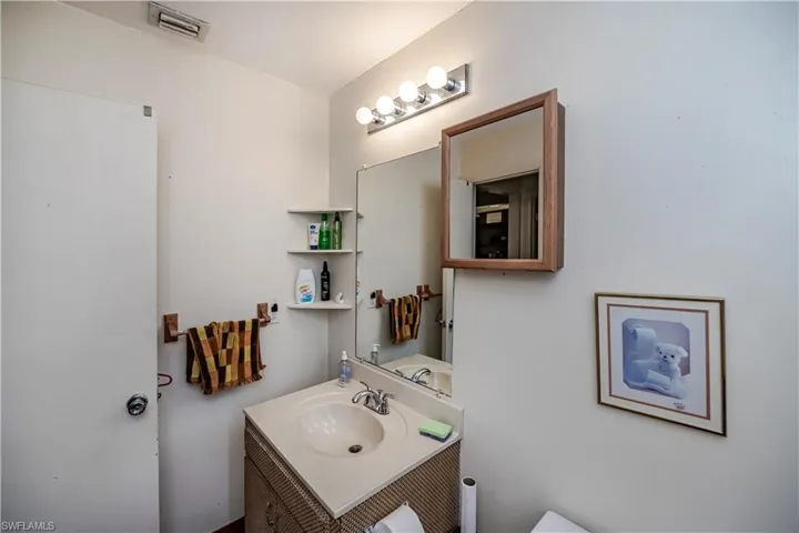 Bathroom with vanity and toilet