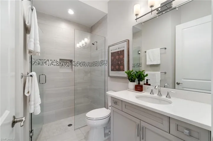 Guest Bathroom with beautifully tiled walk in shower
