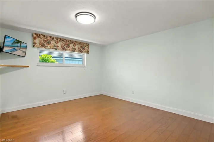 Spare room featuring hardwood / wood-style floors