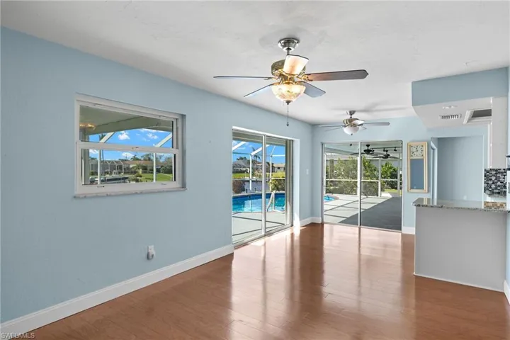 Spare room with hardwood / wood-style flooring and ceiling fan