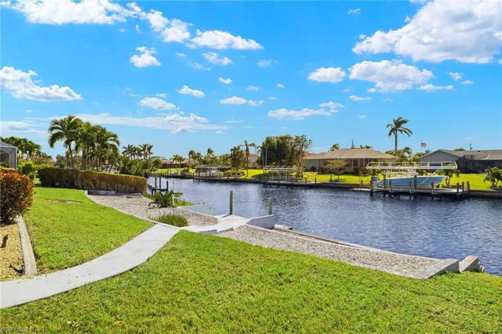 View of water feature with a dock