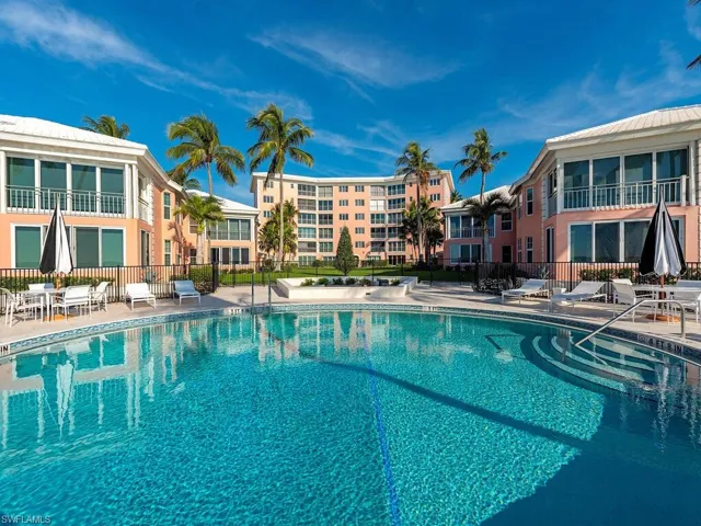 Community pool featuring a patio area