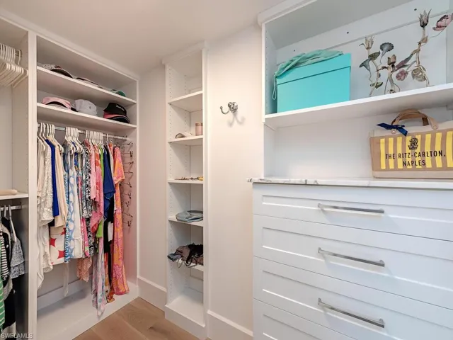 Walk in closet featuring light wood-style flooring