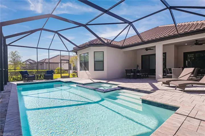 Upgraded saltwater pool and spa with sliders from living and kitchen to the lanai