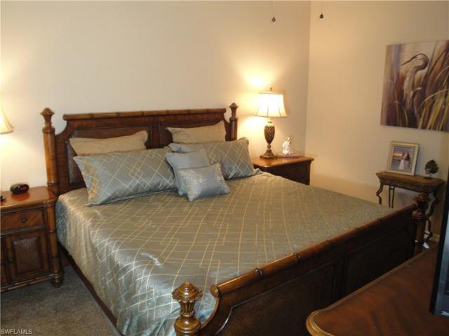King size bed and Bahamian style furnishings with a big screen TV