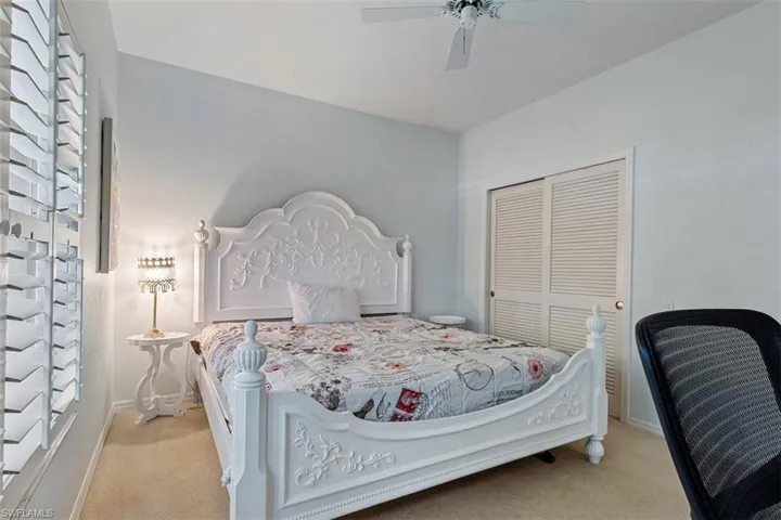 Bedroom featuring carpet floors, a closet, and ceiling fan