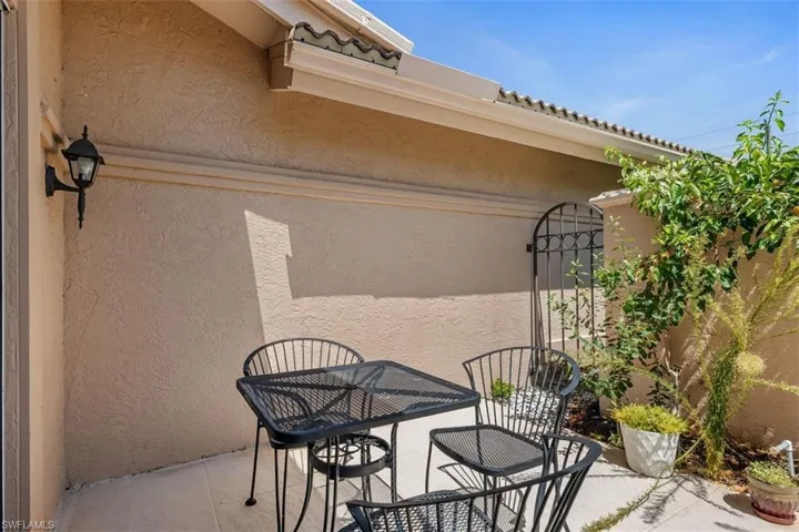 View of patio / terrace with a gate and outdoor dining space