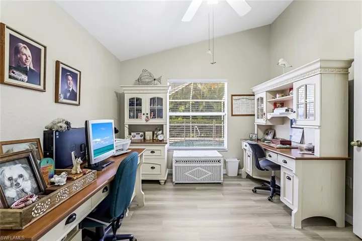 3rd bedroom is used as an office featuring lofted ceiling, light wood-type LVP flooring, and ceiling fan