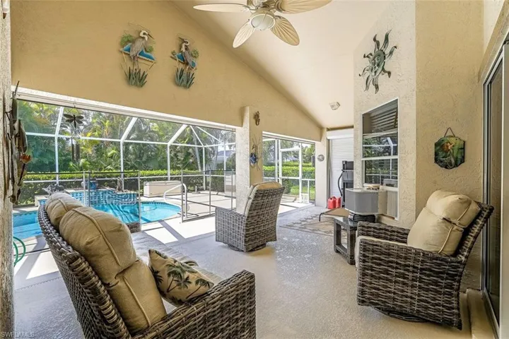 Lanai area with ceiling fan and lofted ceiling