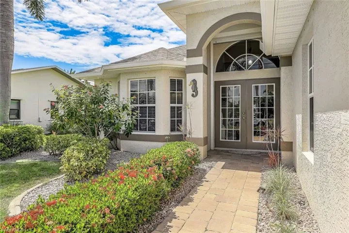 View of exterior entry featuring french doors