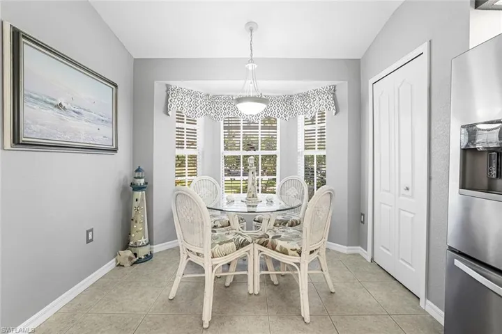 Kitchen Dining area featuring light tile floors