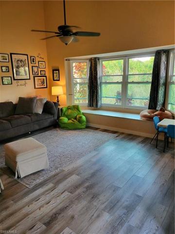 Living Room with bench seat and storage under window