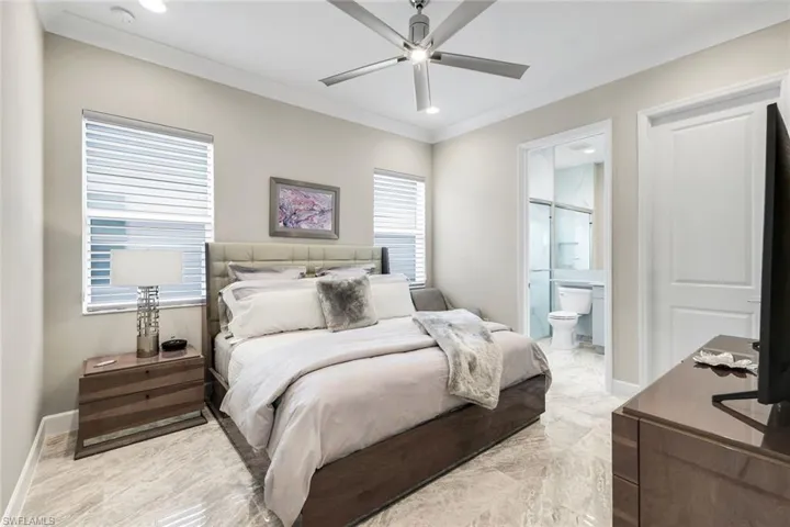 Bedroom featuring ornamental molding, recessed lighting, a ceiling fan, and connected bathroom