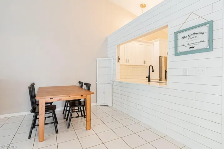 View of tiled entrance foyer and kitchen eating area
