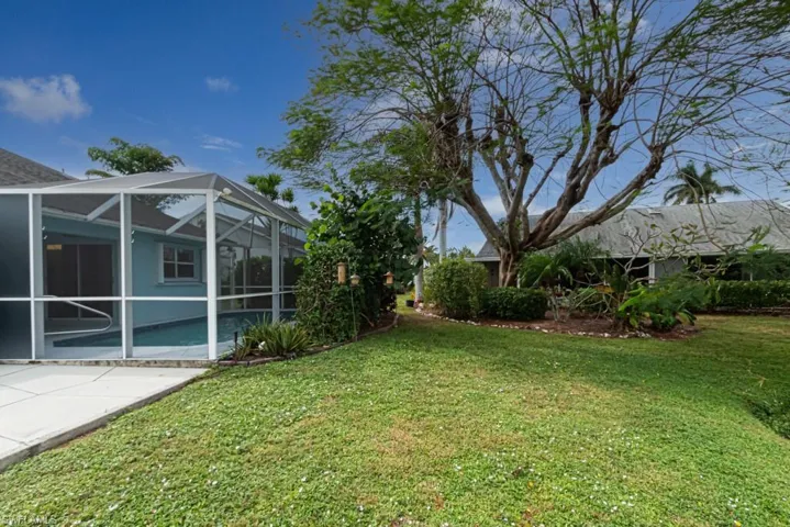 View of yard featuring a lanai