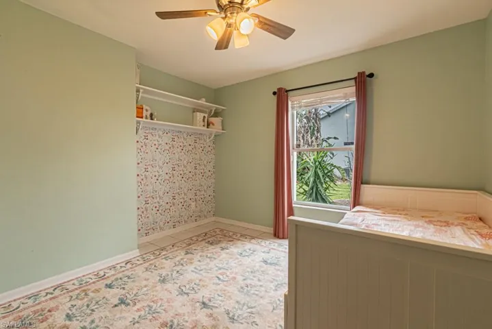 Unfurnished bedroom with ceiling fan